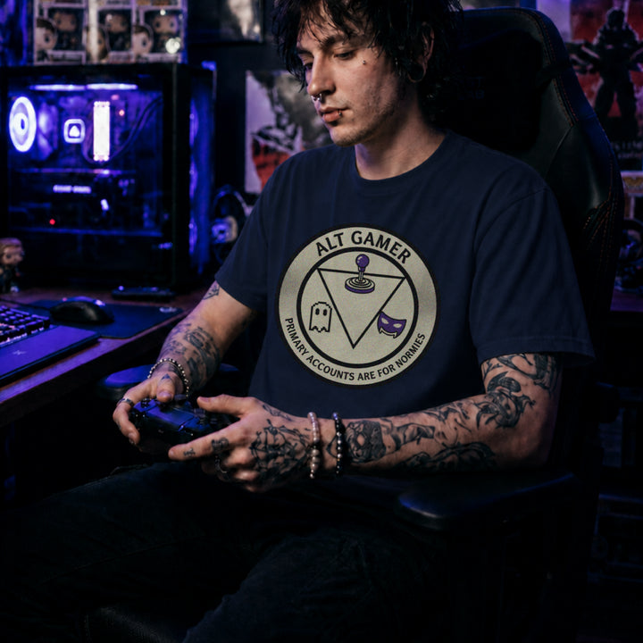 Translation missing: en.Navy t-shirt with a retro arcade badge reading Alt Gamer Primary Accounts Are For Normies with purple joystick