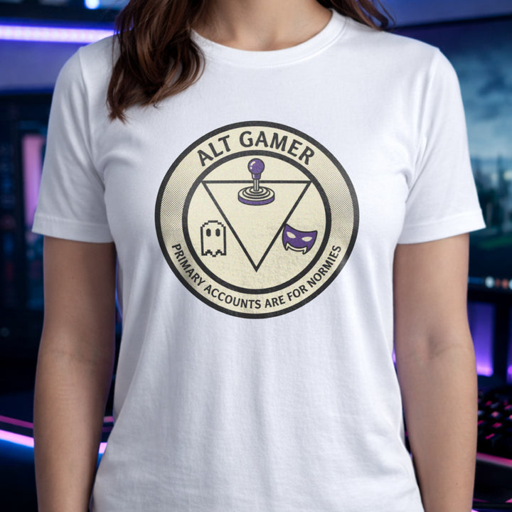 Translation missing: en.White t-shirt with a retro arcade badge reading Alt Gamer Primary Accounts Are For Normies with purple joystick