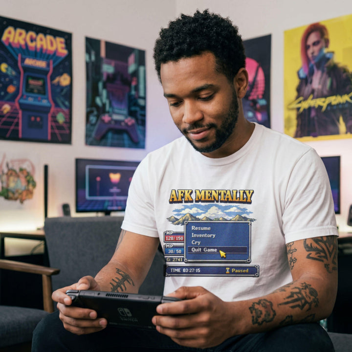 Translation missing: en.White Maroon tee with gold AFK Mentally text over a pixel art retro RPG menu box with a cursor hovering on Quit Game