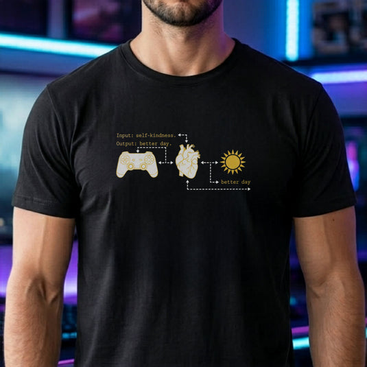 Translation missing: en.Black tee with gold flowchart connecting a game controller, anatomical heart, sun, and text Input self-kindness