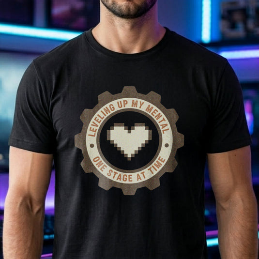 Translation missing: en.Black tee with pixel heart centered in cog badge graphic text, "leveling up my mental one stage at a time"