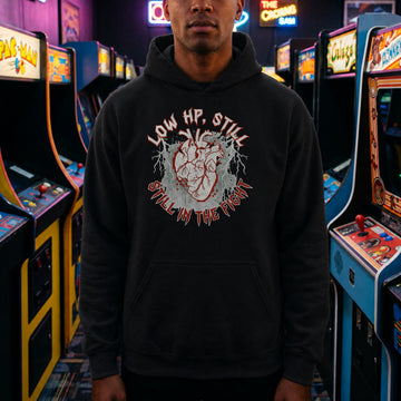 Translation missing: en.Black pullover hoodie with heart graphic text, LOW HP STILL IN THE FIGHT