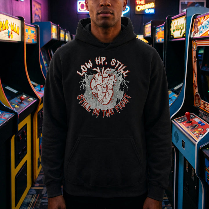 Translation missing: en.Black pullover hoodie with heart graphic text, LOW HP STILL IN THE FIGHT