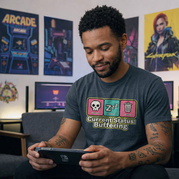 Translation missing: en.Dark heather Retro pixel art tee with Poison, Sleep, Brain icons and text reading Current Status Buffering for gamers