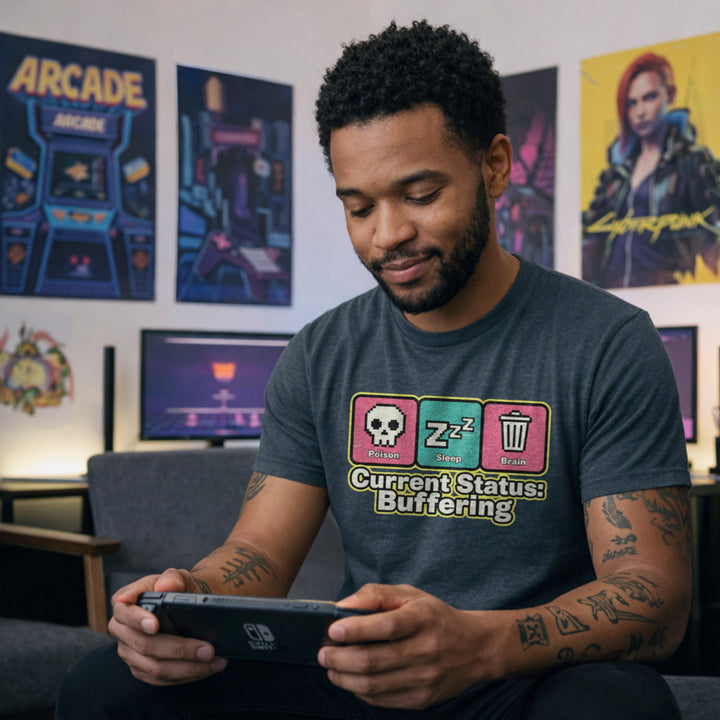 Translation missing: en.Dark heather Retro pixel art tee with Poison, Sleep, Brain icons and text reading Current Status Buffering for gamers