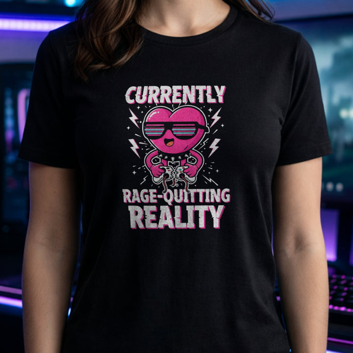 Translation missing: en.Black tee with a pink heart cartoon wearing sunglasses, ripping a controller, and Rage-Quitting Reality text