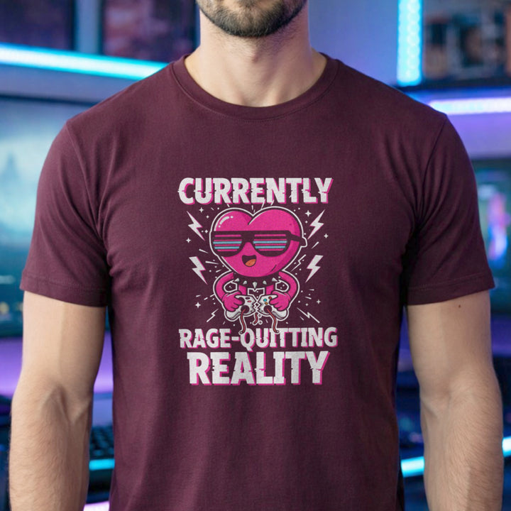 Translation missing: en.Maroon tee with a pink heart cartoon wearing sunglasses, ripping a controller, and Rage-Quitting Reality text