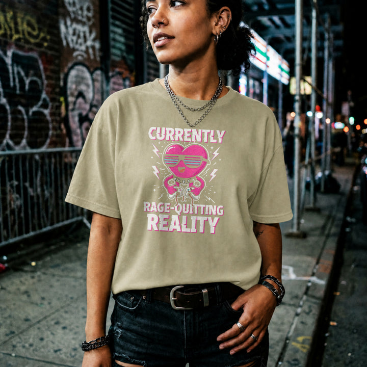 Translation missing: en.Natural tee with a pink heart cartoon wearing sunglasses, ripping a controller, and Rage-Quitting Reality text