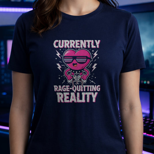 Translation missing: en.Navy tee with a pink heart cartoon wearing sunglasses, ripping a controller, and Rage-Quitting Reality text