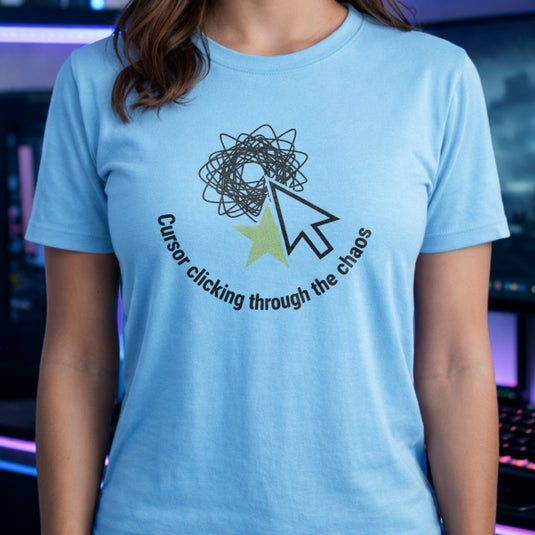 Translation missing: en.Light blue tee with a large mouse cursor clicking a green star beneath a scribble, reading Cursor clicking through the chaos