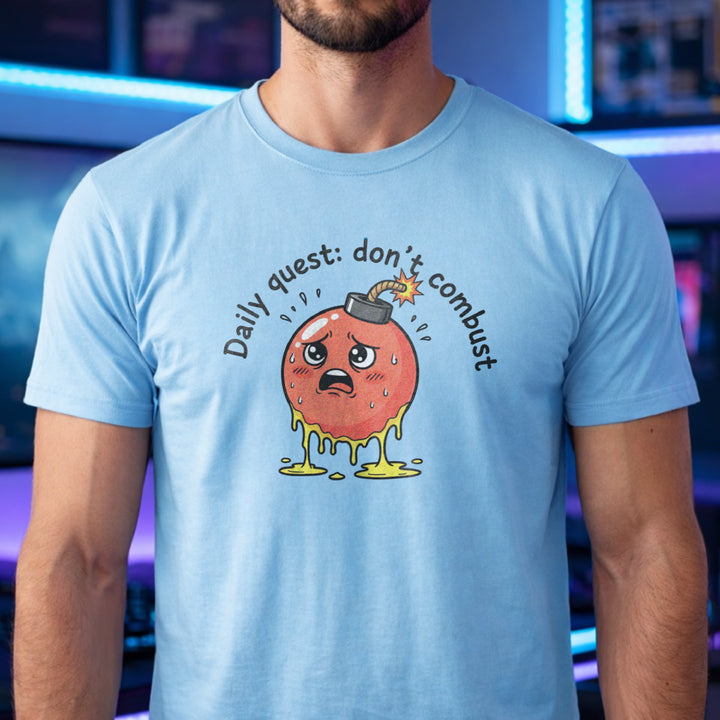 Translation missing: en.Light blue tee with cute sweating cartoon bomb graphic reading Daily quest: don't combust