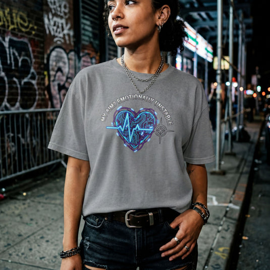 Translation missing: en.Graphite heather tee with text My Aim Emotionally Unstable around a glowing cyber circuit heart, pulse line, and crosshair