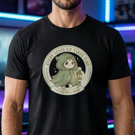 Translation missing: en.Tee with Circular green emblem showing a cute hooded fantasy character holding a lantern with Every Level-Up Takes Time text