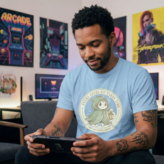 Translation missing: en.Tee with Circular green emblem showing a cute hooded fantasy character holding a lantern with Every Level-Up Takes Time text
