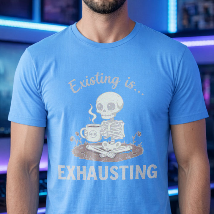 Translation missing: en.White text Existing is Exhausting around a cute skeleton sitting cross legged holding a skull coffee mug on Carolina blue tee. 