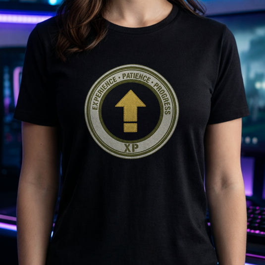 Translation missing: en.Black t-shirt with a green circular emblem reading Experience Patience Progress XP around a gold level up arrow