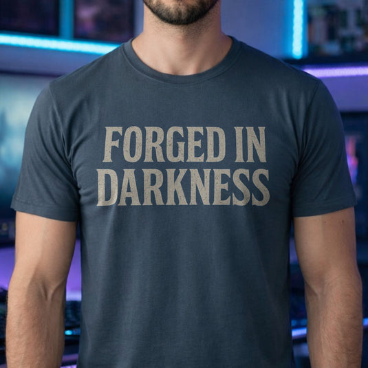 Translation missing: en.Dark heather gamer t-shirt reading Forged In Darkness in a white distressed vintage font