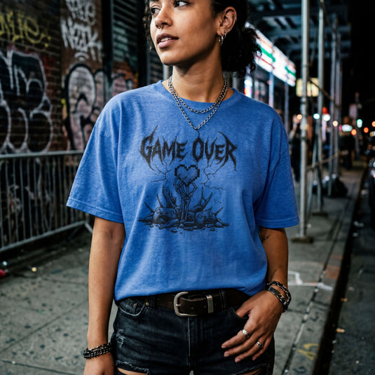 Translation missing: en.Heather royal gamer t-shirt with heavy metal Game Over text, a skeleton hand holding a pixel heart, and controllers