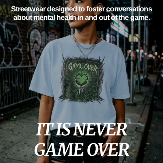 Translation missing: en.Image with overlay text "IT IS NEVER GAME OVER" Sub text "Streetwear designs to foster conversations about mental health in and out of the game."