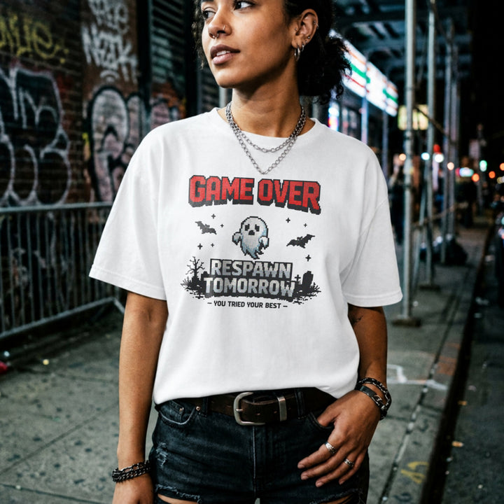 Translation missing: en.White tee with retro pixel text reading Game Over Respawn Tomorrow You Tried Your Best with a ghost and bats