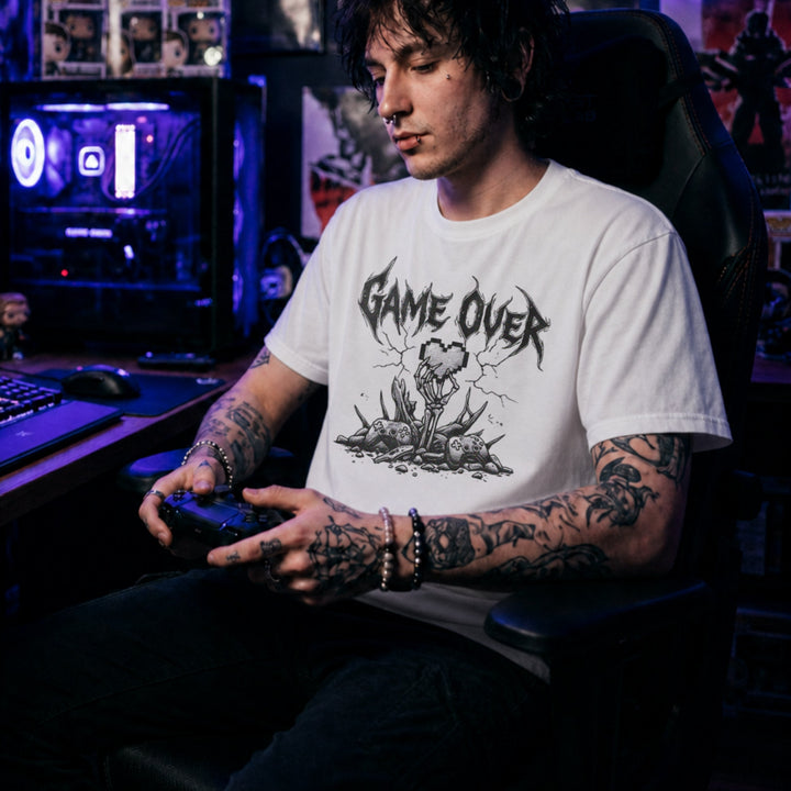 Translation missing: en.White gamer t-shirt with heavy metal Game Over text, a skeleton hand holding a pixel heart, and controllers