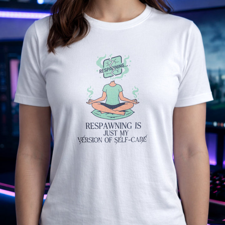 Translation missing: en.White gamer tee with a meditating person graphic and text Respawning is just my version of self-care