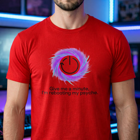 Translation missing: en.Red t-shirt graphic with a restart symbol over a purple swirl reading Give me a minute, I'm rebooting my psyche