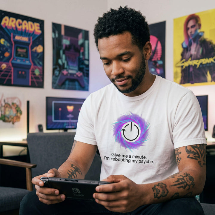 Translation missing: en.White t-shirt graphic with a restart symbol over a purple swirl reading Give me a minute, I'm rebooting my psyche