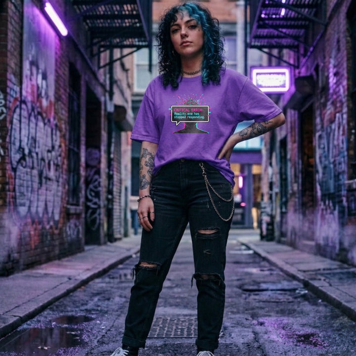 Translation missing: en.Purple graphic tee with glitch art text box reading CRITICAL ERROR: Reality.exe has stopped responding