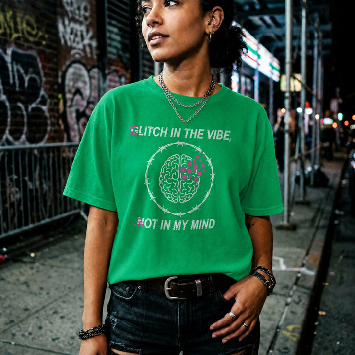 Translation missing: en.Irish green tee with Glitch In The Vibe text, a pixelated brain inside barbed wire, and text Not In My Mind