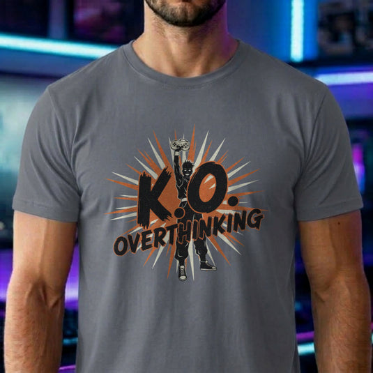 Translation missing: en.Graphite heather shirt with a silhouette fighter holding a controller high, starburst graphic, and text K.O. Overthinking