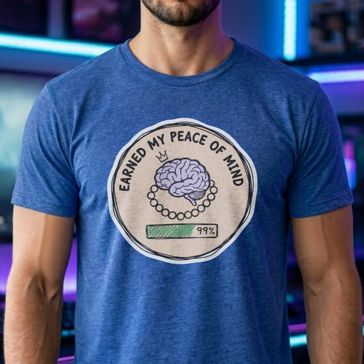 Translation missing: en.Heather Royal cotton tee with brain illustration coin graphic and text "EARNED MY PEACE OF MIND"