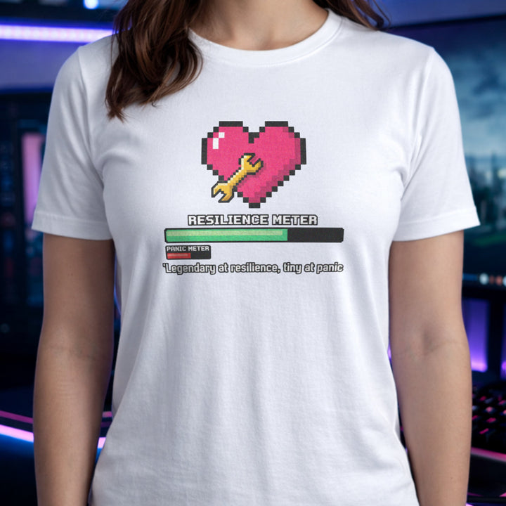 Translation missing: en.White gamer tee graphic with pixel heart, wrench, loading bar, and text Legendary at resilience, tiny at panic