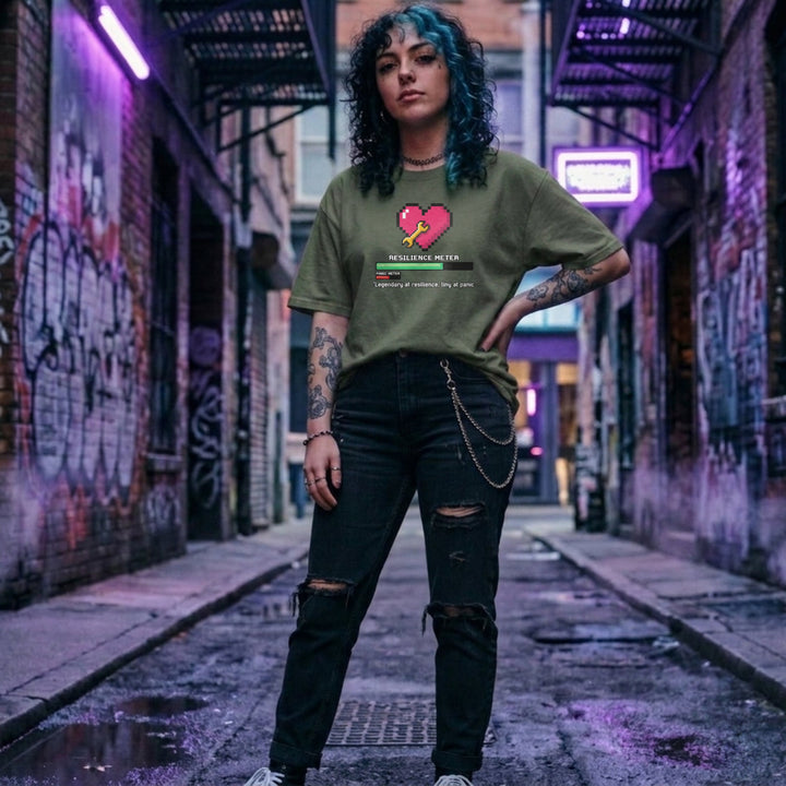 Translation missing: en.Military green gamer tee graphic with pixel heart, wrench, loading bar, and text Legendary at resilience, tiny at panic