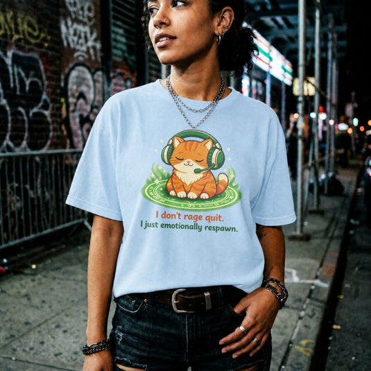 Translation missing: en.Light Blue cotton tee laid-back orange cat with headphones graphic text, "I don't rage quit I just emotionally respawn