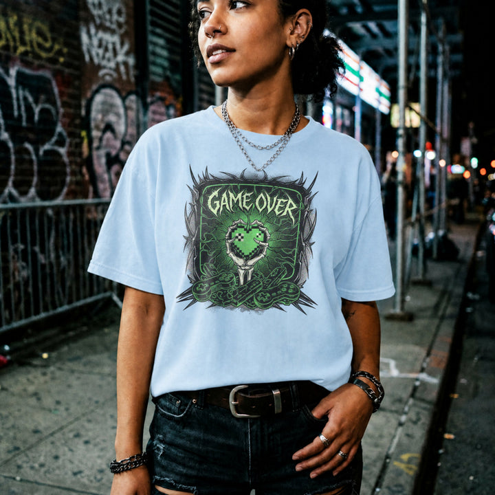 Translation missing: en.Light blue cotton tee with graphic of a bone hand holding heart in pixel art style and text "GAME OVER"