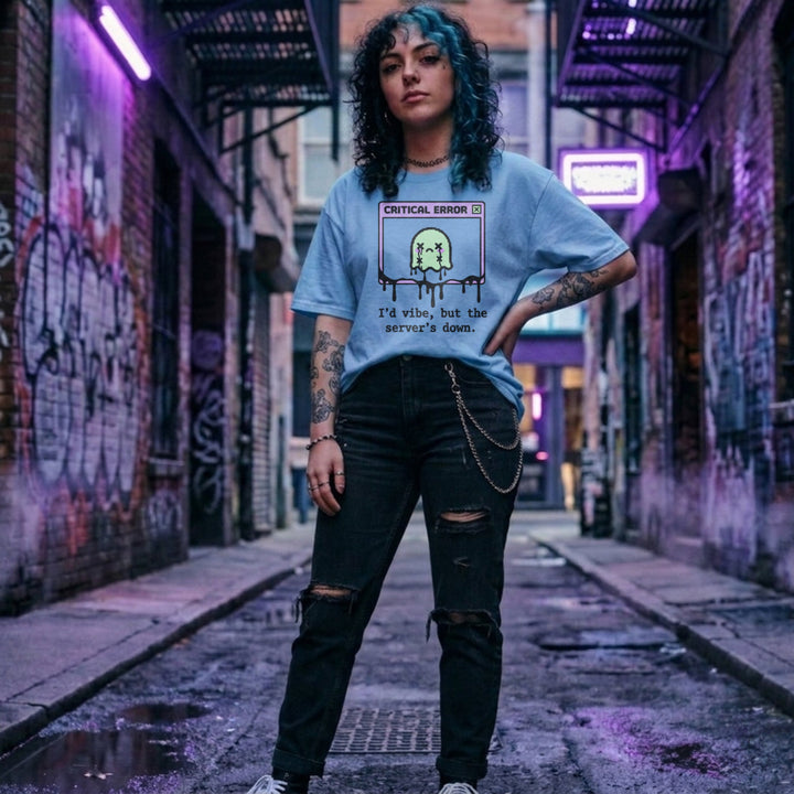 Translation missing: en.Light blue cotton tee with graphic critical error box with pixel art character text "I'd vibe but server's down"