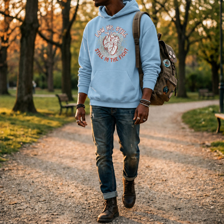 Translation missing: en.Light blue pullover hoodie with heart graphic text, LOW HP STILL IN THE FIGHT