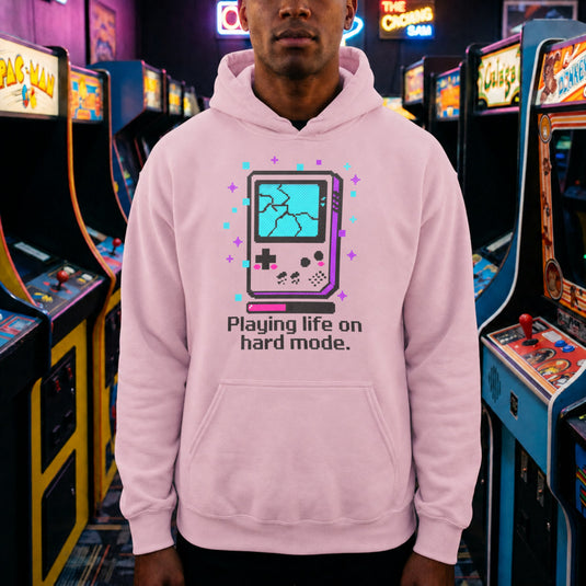 Translation missing: en.Light Pink Pullover Hoodie Retro Glitch Handheld Gamer Graphic With Text, Playing Life on Hard Mode