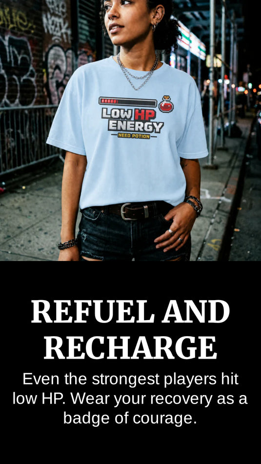 Translation missing: en.Person wearing a light blue t-shirt with text on a street background, with text overlay 'REFUEL AND RECHARGE'