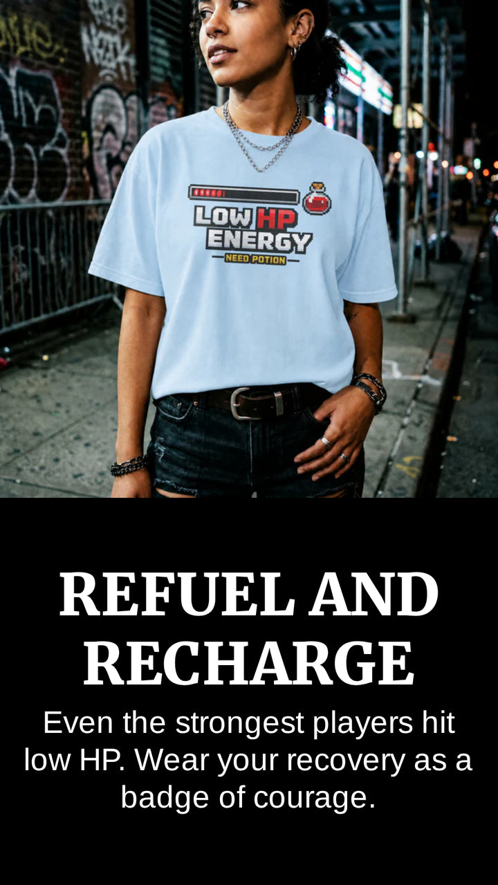 Translation missing: en.Person wearing a light blue t-shirt with text on a street background, with text overlay 'REFUEL AND RECHARGE'