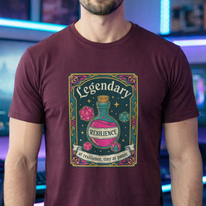 Translation missing: en.maroon cotton tee with dice and resilience potion tarot card graphic and text, "Legendary at resilience, tiny at panic"