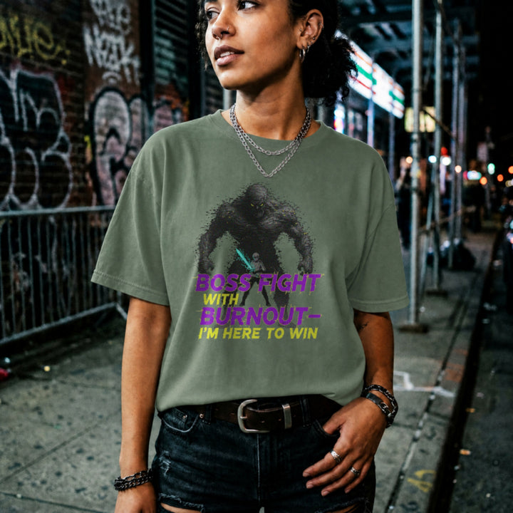 Translation missing: en.Military green t-shirt with a glowing warrior facing a giant monster and purple text reading Boss Fight With Burnout