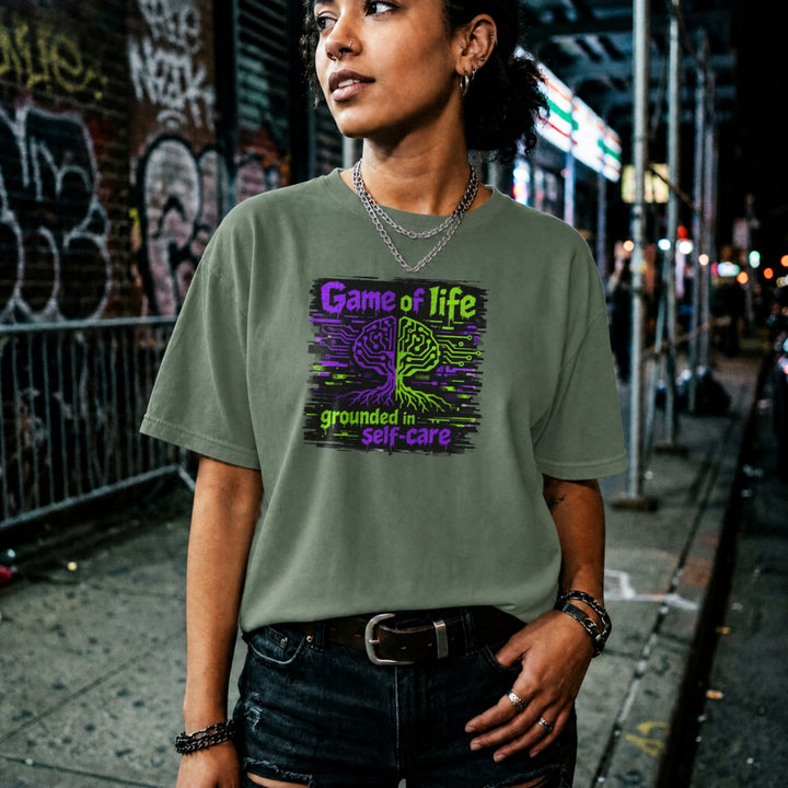 Translation missing: en.Military green t-shirt with Game of life grounded in self-care neon graphic showing a circuit board brain tree design