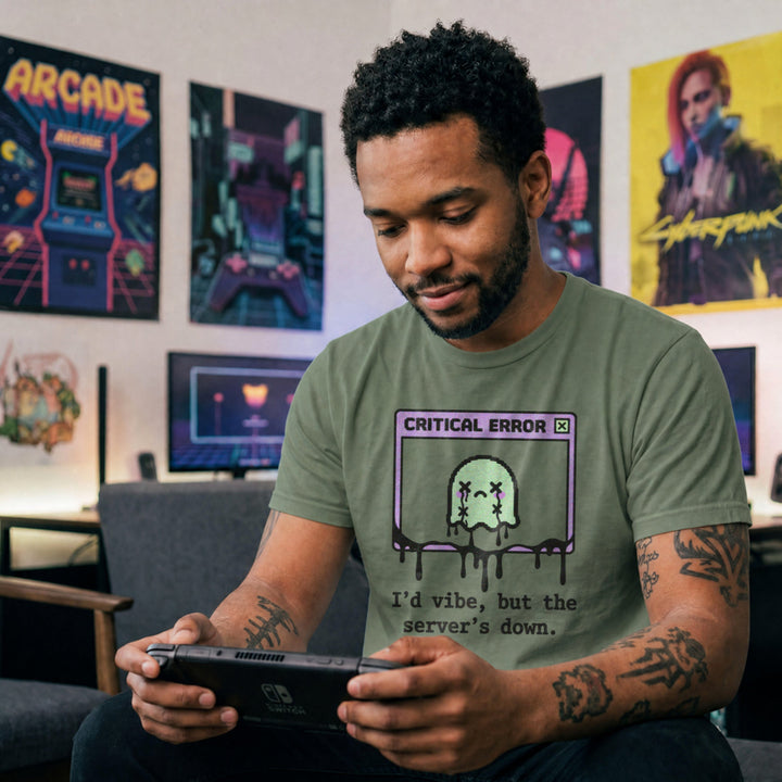 Translation missing: en.Military green cotton tee with graphic critical error box with pixel art character text "I'd vibe but server's down"