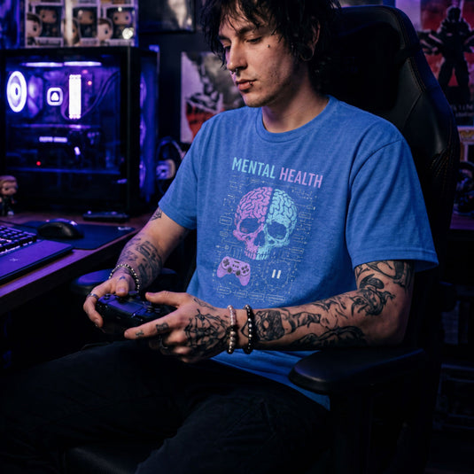 Translation missing: en.Alt n Vibe heather royal shirt with text Mental Health above a split purple and blue skull brain graphic, controller, and circuits