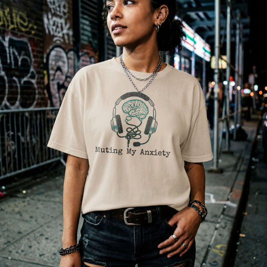 Translation missing: en.Natural tee with graphic: headphones connected to a brain and text, "Muting my anxiety"