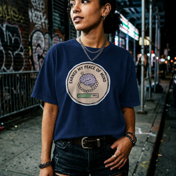 Translation missing: en.Navy cotton tee with brain illustration coin graphic and text "EARNED MY PEACE OF MIND"