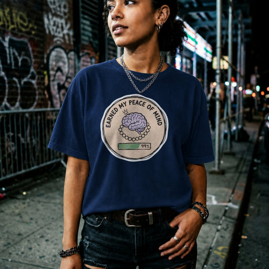 Translation missing: en.Navy cotton tee with brain illustration coin graphic and text "EARNED MY PEACE OF MIND"