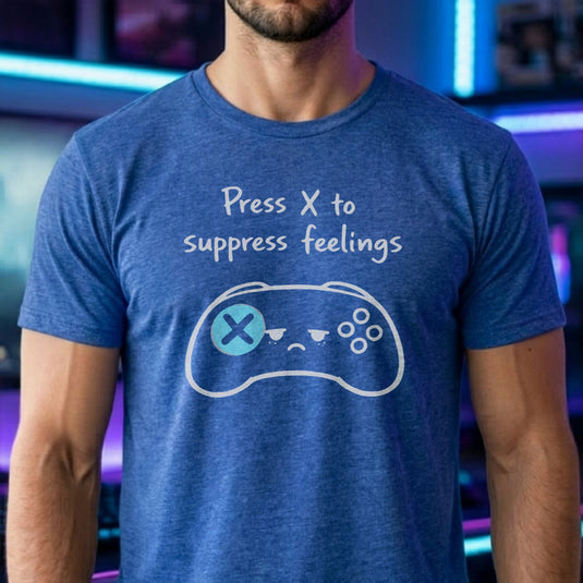 Translation missing: en.Heather royal gamer shirt graphic showing a sad video game controller with text reading Press X to suppress feelings. 
